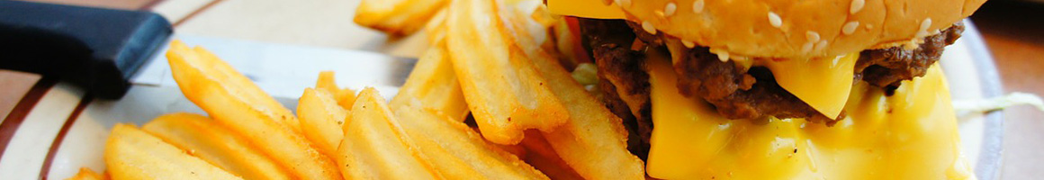 Eating American (Traditional) Burger at Dan's the Grub Shack restaurant in Atascadero, CA.